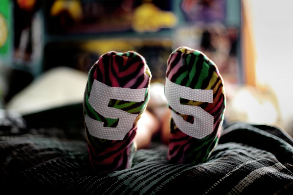 Manly Guys Redefining Masculinity with Animal Print Fleece Slippers using Green Pepper Pattern and Jiffy Grip Leopard, Giraffe, Zebra Rainbow Print