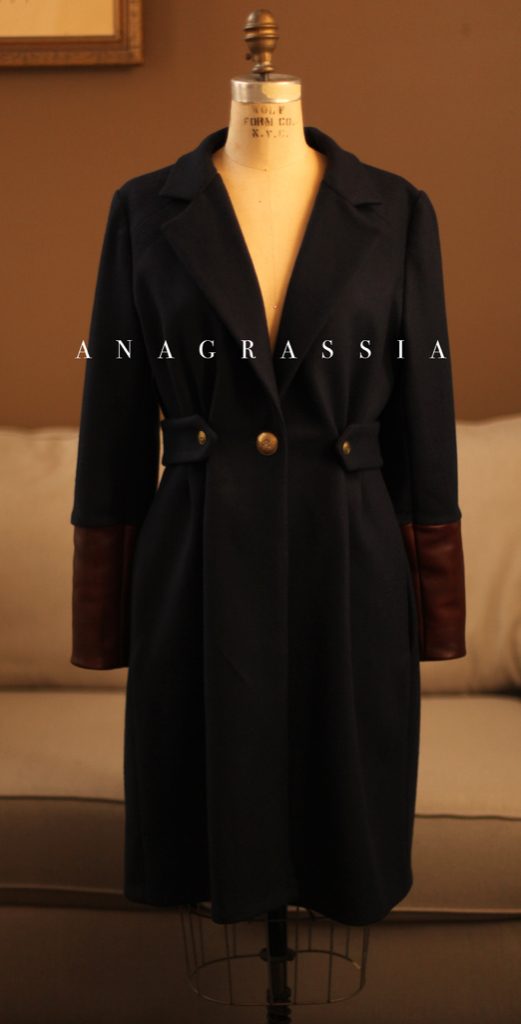 A navy wool cashmere jacket coat with brown real leather with gold buttons for Notre Dame. Bespoke custom tailoring Worn with Ukrainian hand embroidered blouse