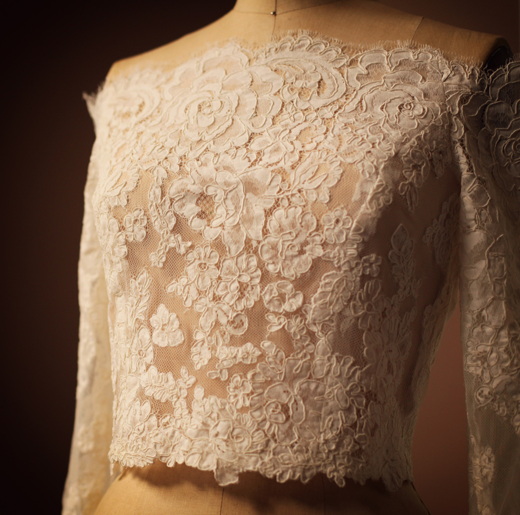 A custom handmade Ivory White Alencon Lace Bolero Topper Cover UP Jacket for winter wedding. Anagrassia used floral applique for couture sewing techniques.