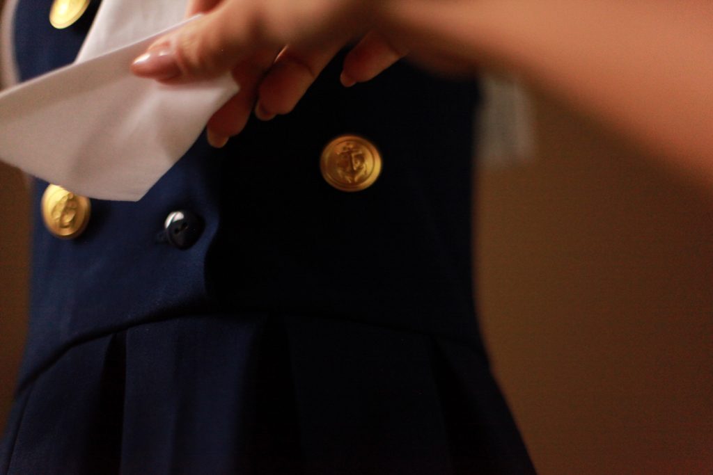 Best sleeveless navy girls sailor nautical dress with white collar, tie, drop waist pleated skirt, and gold buttons for Memorial, Independence, and Labor Day