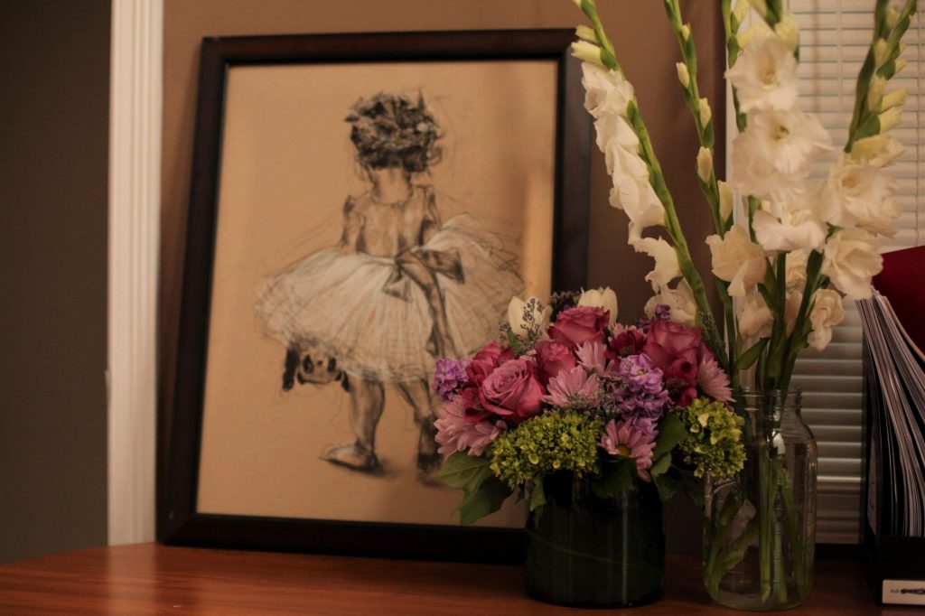 flower girl dress sketch with charcoal on brown paper