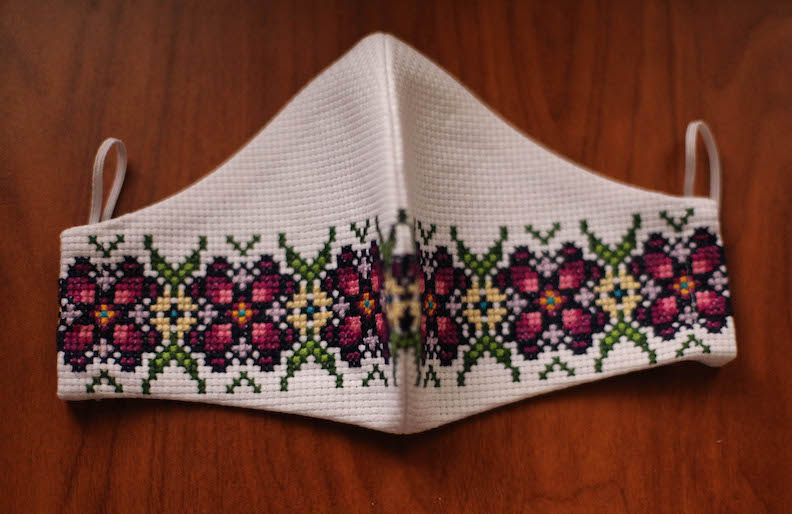 Purple green hand embroidered face mask with Ukrainian design