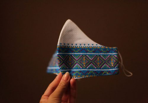 bright blue face mask with folk ukrainian hand embroidery