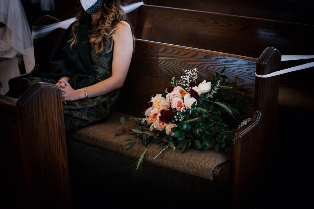 A handmade custom bridesmaid gown with dark green silk florals and shawl